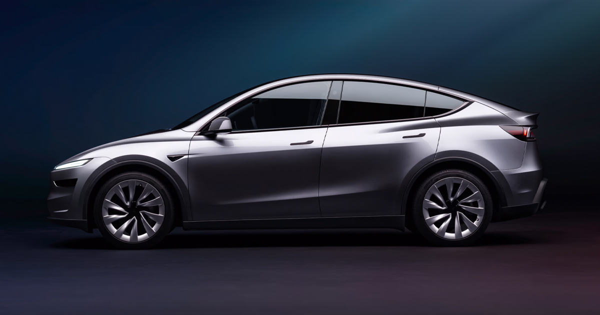 2025 silver Tesla Model Y side angle