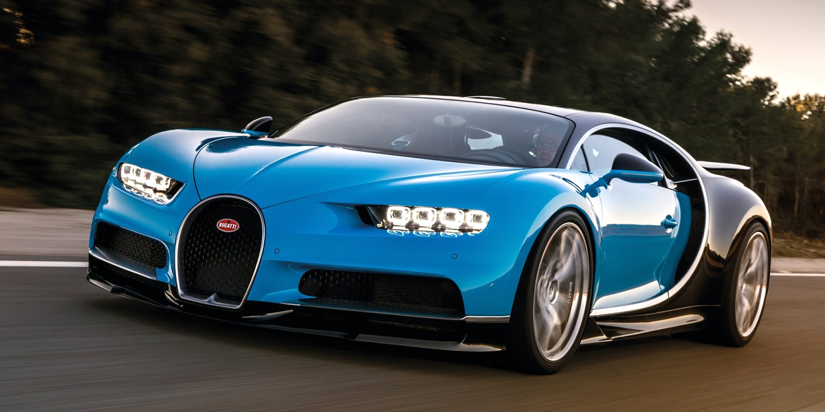 A blue Bugatti Chiron with wheels spinning