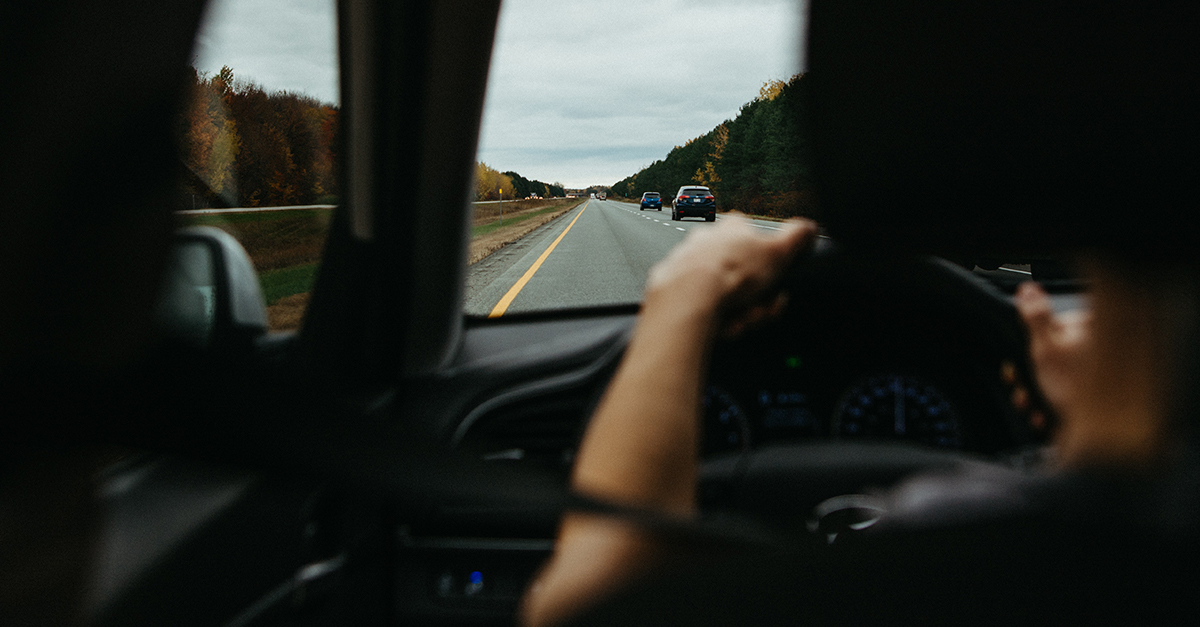 View of the road ahead from inside a car