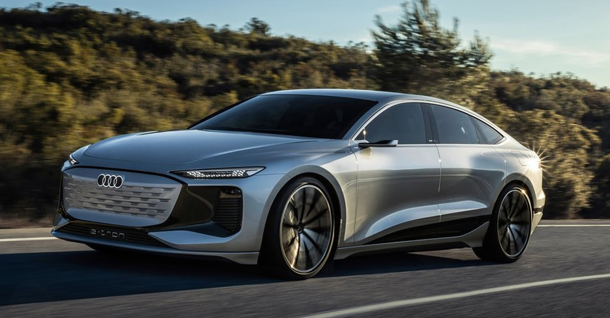 Front view of the Audi A6 e-tron driving down a country road