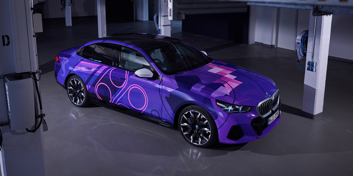 Side view of the BMW 5 Series with a purple wrap