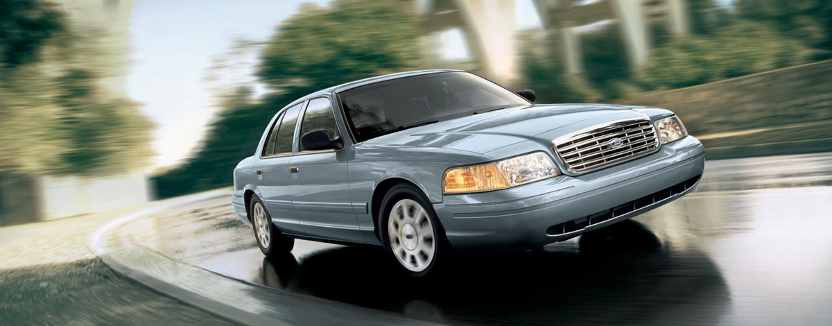 A Ford Crown Victoria driving around a corner