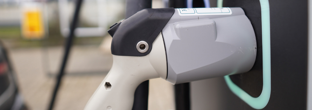 A close-up of an electric vehicle charger
