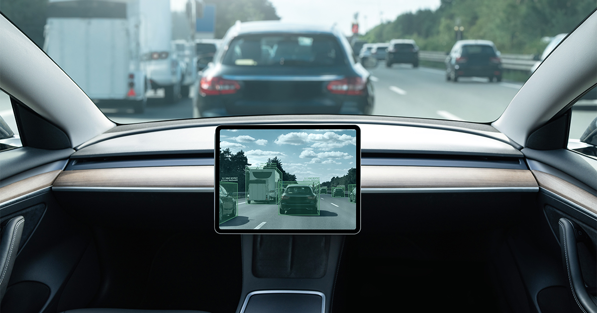 Interior shot of a driverless car stuck in traffic