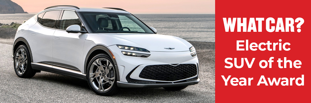 A Genesis GV60 parked on the beach
