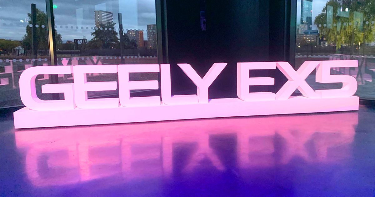 Pink Geely EX5 sign at the UK launch event