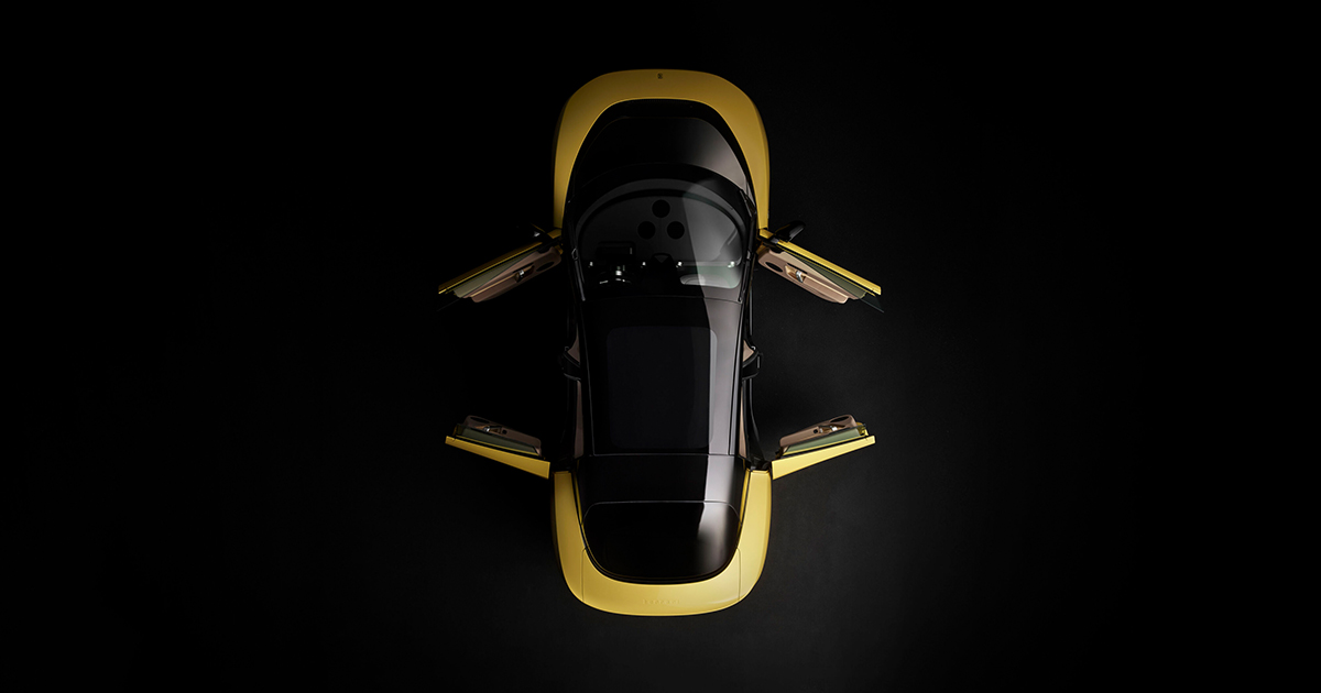 Above angle of a yellow Ferrari Luce with its doors open
