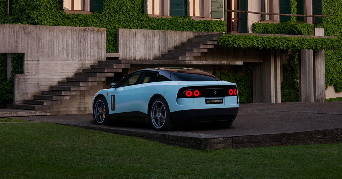 Rear angle of a blue Ferrari Luce parked
