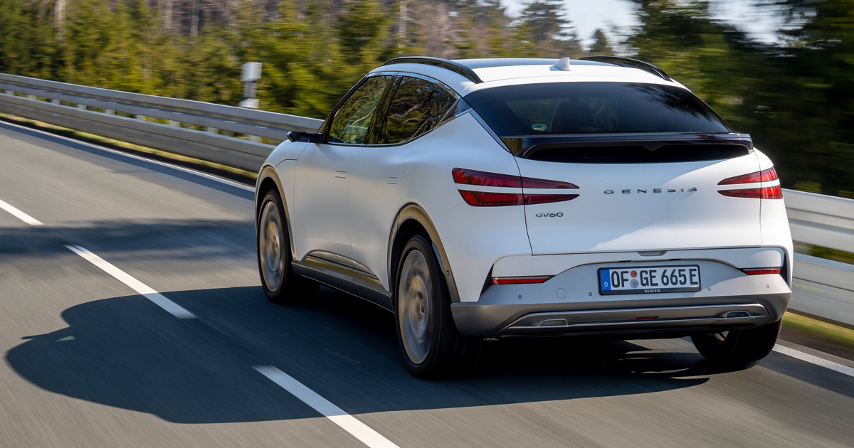 Rear angle of a white Genesis GV60