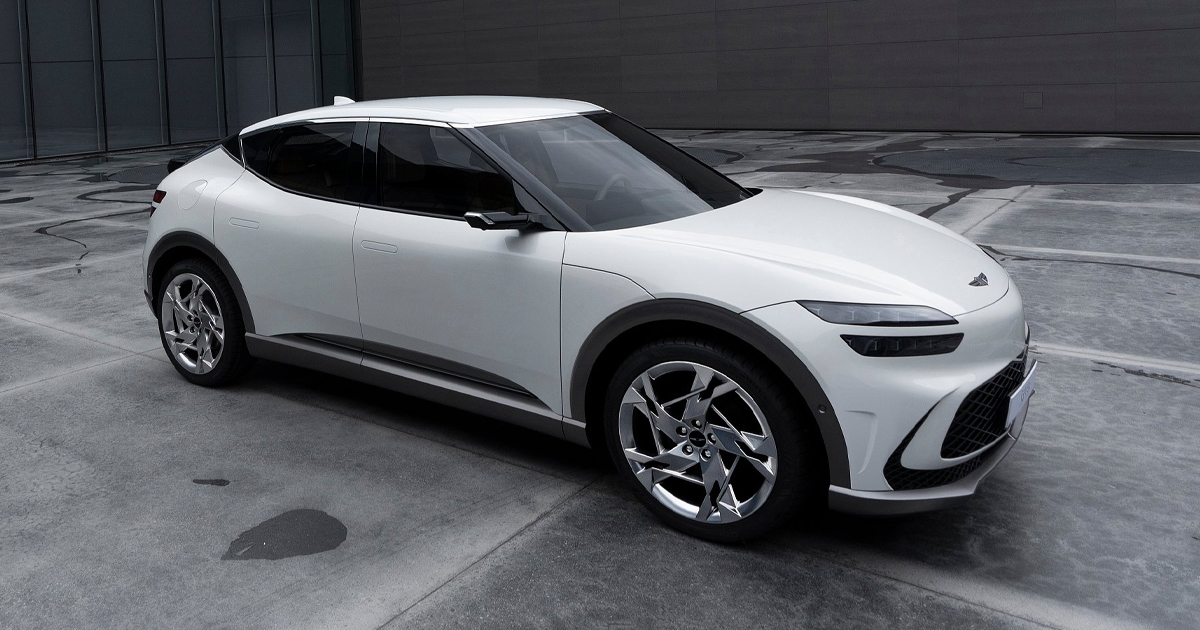Side angle of a white Genesis GV60