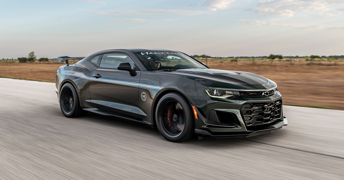 Side angle of a black Hennessey Exorcist driving fast