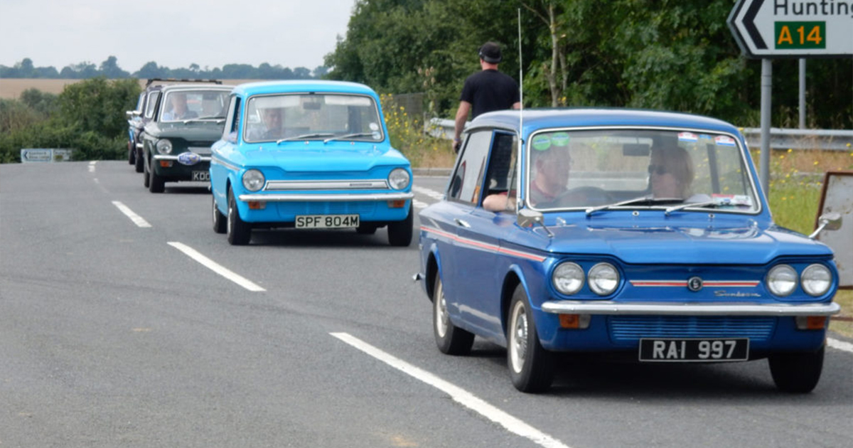 A long queue of Hillman Imp cars in traffic