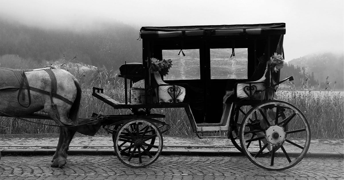 Black and white image of a horse and carriage