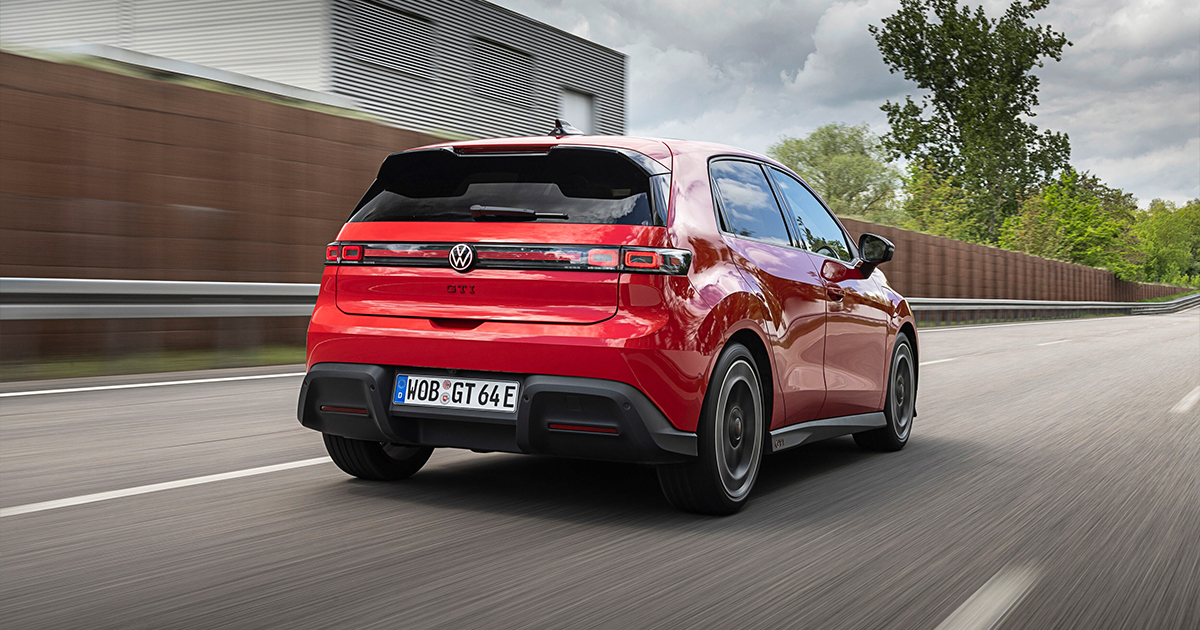 Rear angle of a red Volkswagen ID.Polo GTI driving