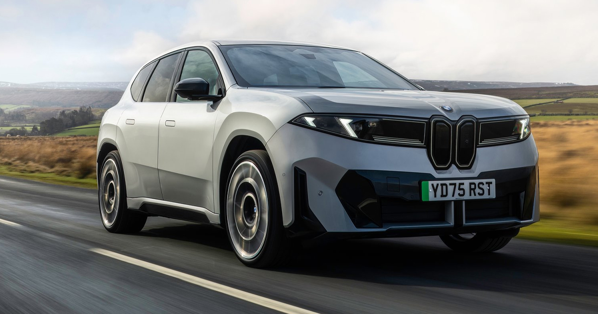 Grey BMW iX3 driving