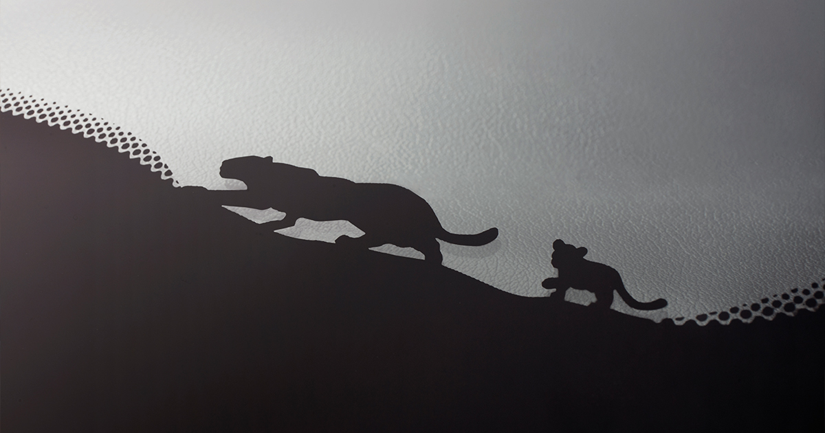 Jaguar mother and cub silhouette on the E-Pace windscreen