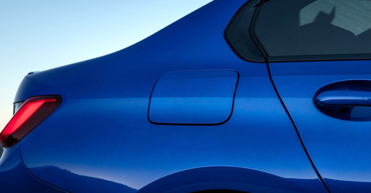 Close-up of a blue car with metallic paint
