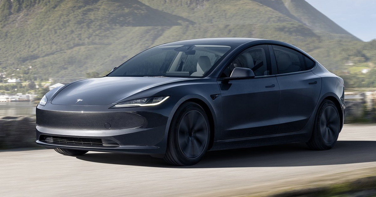 Black Tesla Model 3 driving