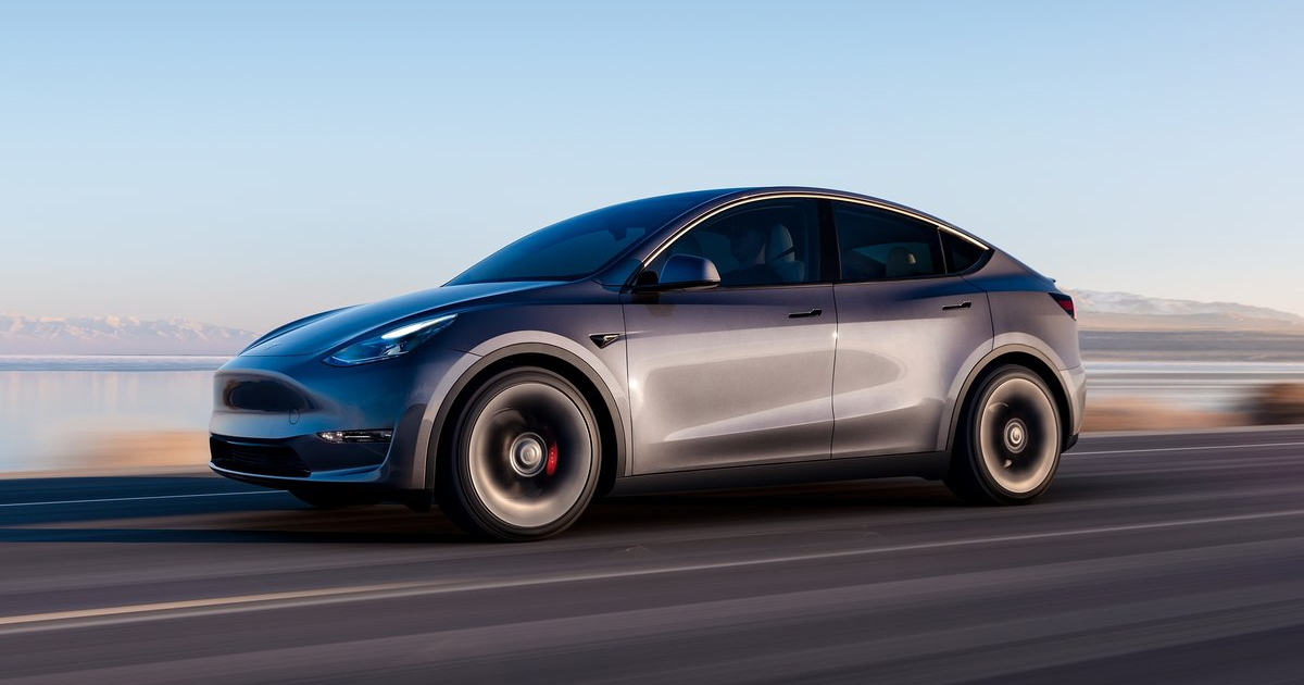 Side angle of the Tesla Model Y SUV driving fast
