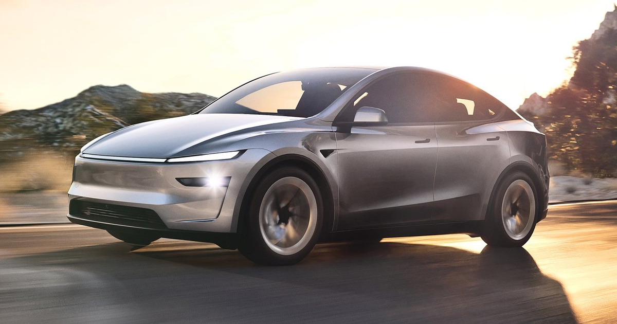 Silver Tesla Model Y driving