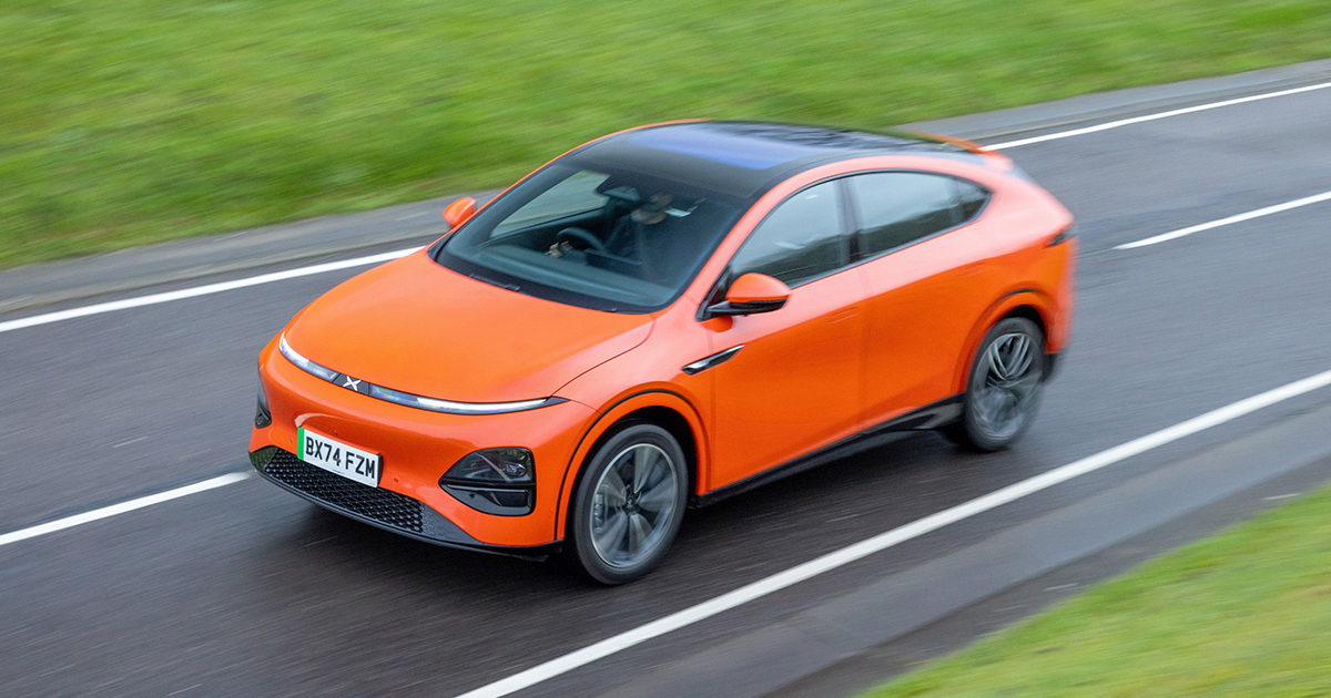Orange XPENG G6 driving