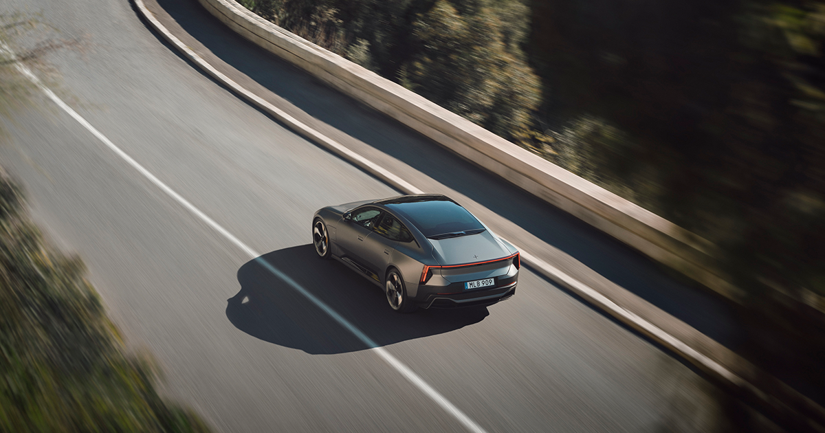 Rear angle of the Polestar 5 driving