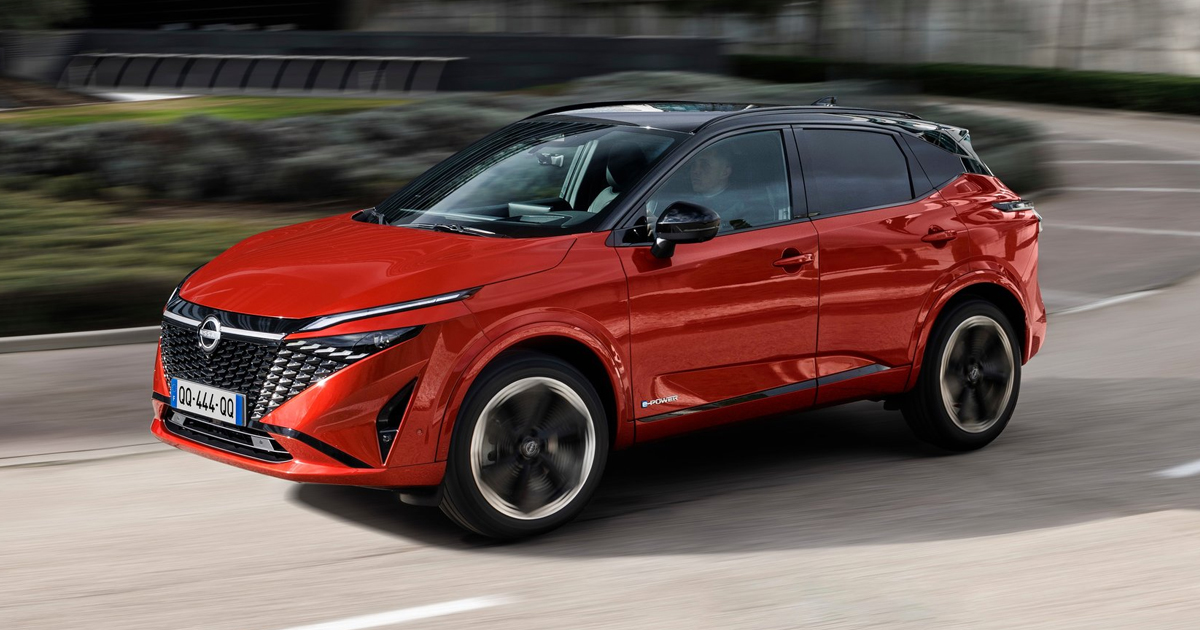 Red Nissan Qashqai driving
