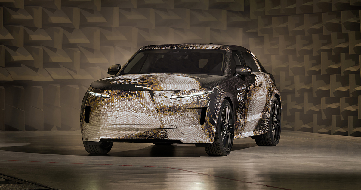 Front angle of a camouflaged Range Rover GT