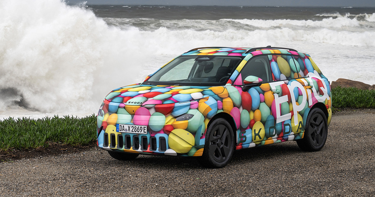 Skoda Epiq prototype in camouflage next to a big wave