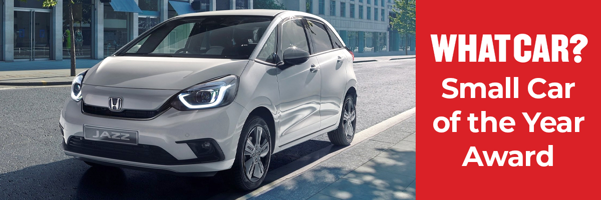 A Honda Jazz parked on the side of the road