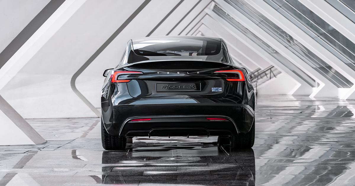 Rear angle of a black Tesla Model 3 Performance