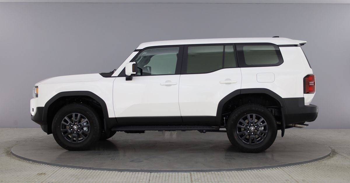 Side angle of a white Toyota Land Cruiser Commercial