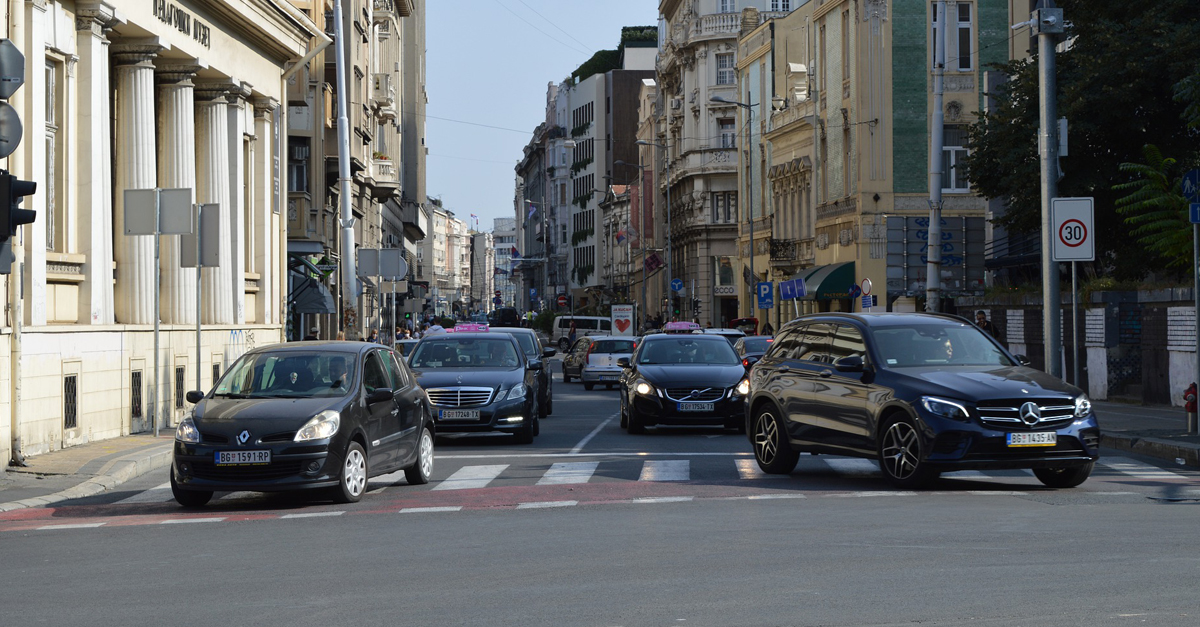 Cars turning out of a junction
