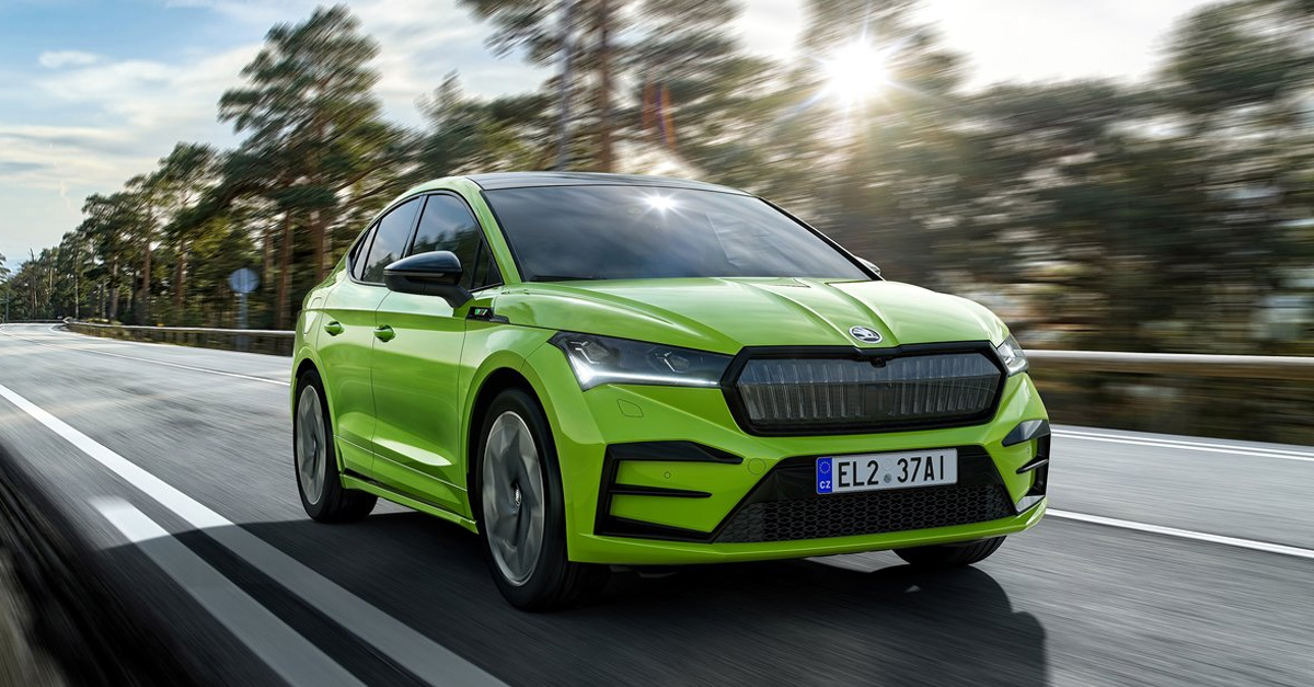 Front view of the Skoda Enyaq Coupe driving down a road