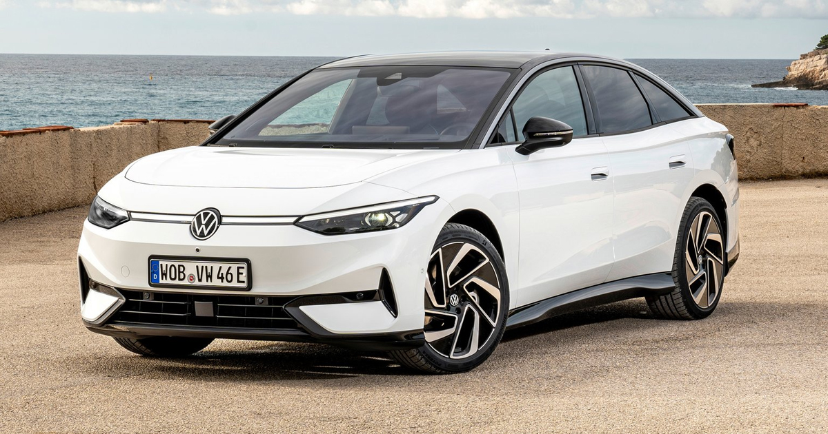 White Volkswagen ID.7 parked in front of the sea