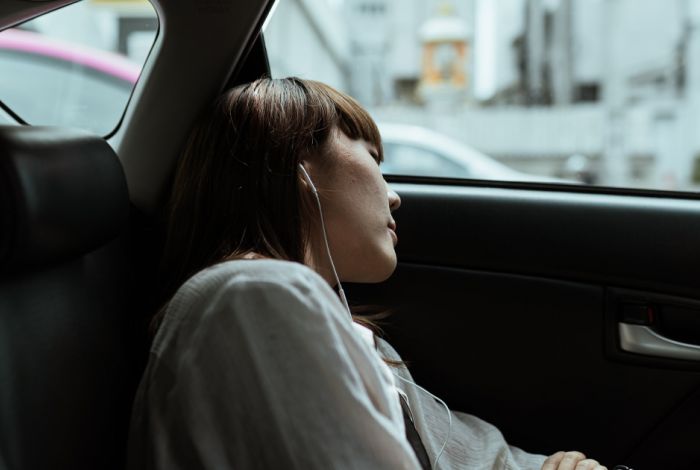 Why does travelling in a car make us tired?
