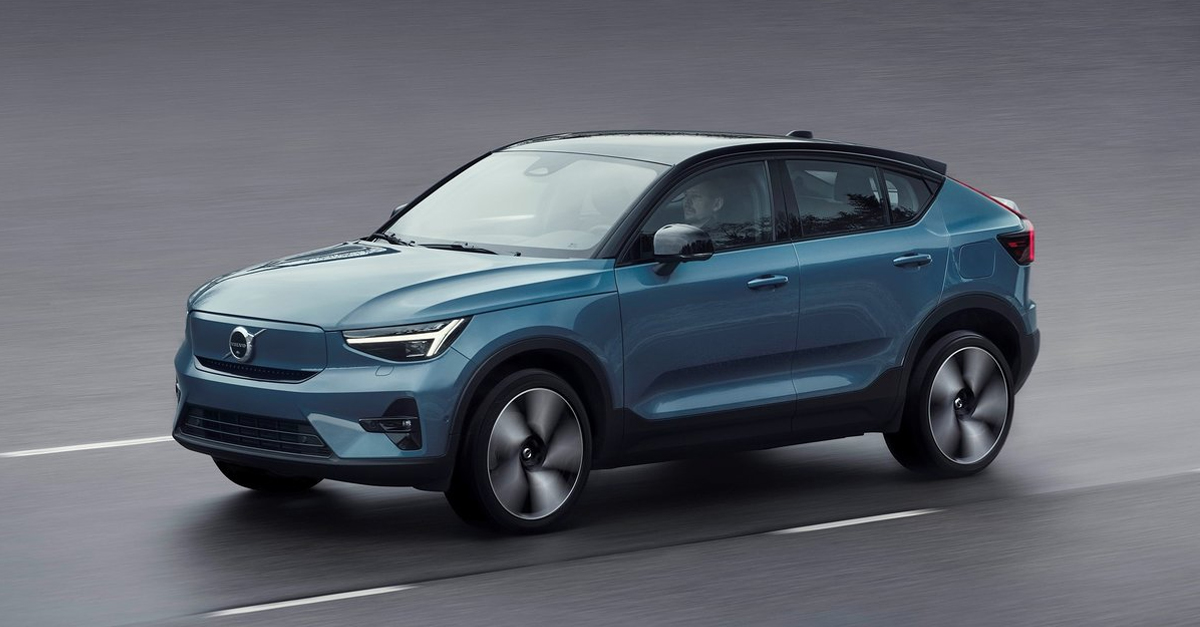 Front view of a Volvo C40 Recharge driving down a road